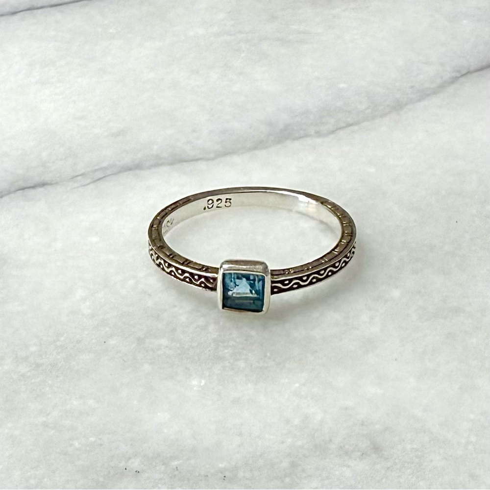 Sundance sterling silver “Wavewatcher” ring featuring a blue faceted topaz